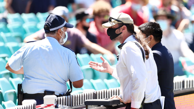 Police and SCG security discuss allegations of crowd abuse.