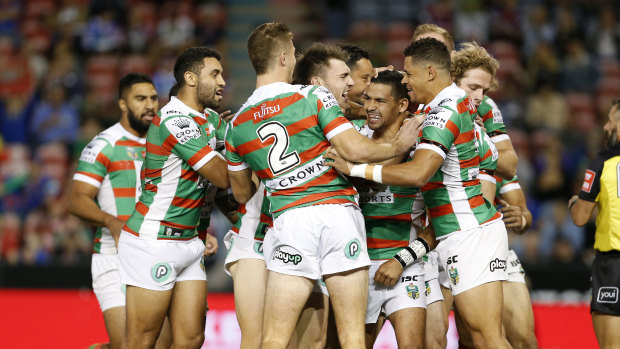 That's the way: Cody Walker is embraced by teammates after scoring against the Knights.
