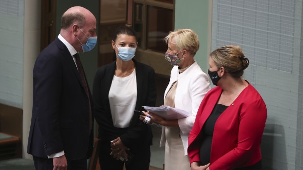 Liberal MPs Trent Zimmerman, Fiona Martin, Katie Allen and Bridget Archer in the Parliament on Thursday morning. They crossed the floor along with their colleague Dave Sharma to help amend the government’s Religious Discrimination Bill.