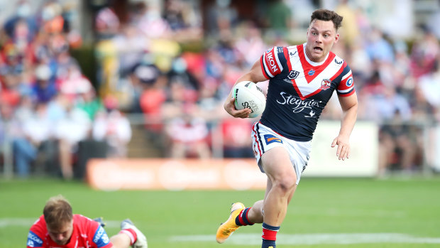 Lachlan Lam makes a break for the Roosters.