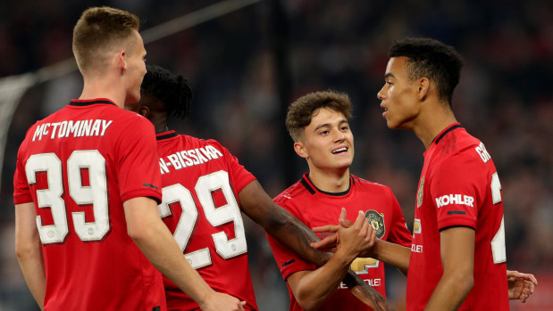 Mason Greenwood (right) is congratulated by teammates after scoring against Leeds.