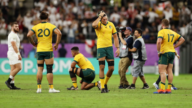All over: The Wallabies are shattered after the heavy loss to England.