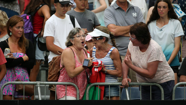 A third woman tries to intervene. 