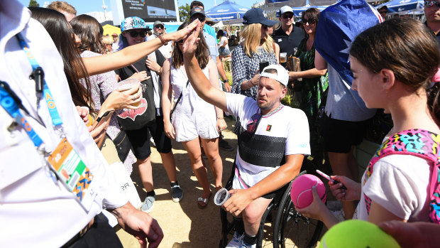 Dylan Alcott is surrounded by fans after his most recent Australian Open win.
