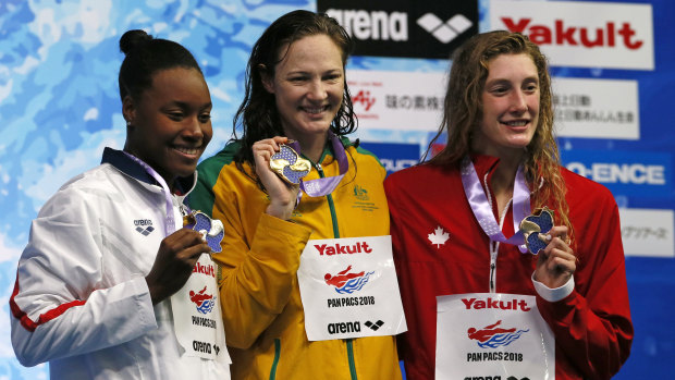 Crowning moment: Cate Campbell on the podium with second-placed Simone Manuel, left of the US, and third-placed Ruck Taylor of Canada.