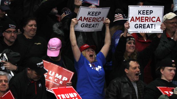 Supporters cheer as President Donald Trump speaks at the Toledo campaign rally.
