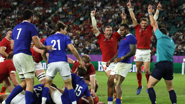 Wales celebrate the Ross Moriarty try that gave them the edge over France on Sunday night. 