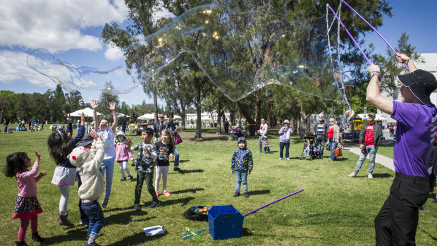 Bubble master, Liam Johnson, entertains kids at the 30th birthday event for Questacon on Saturday.