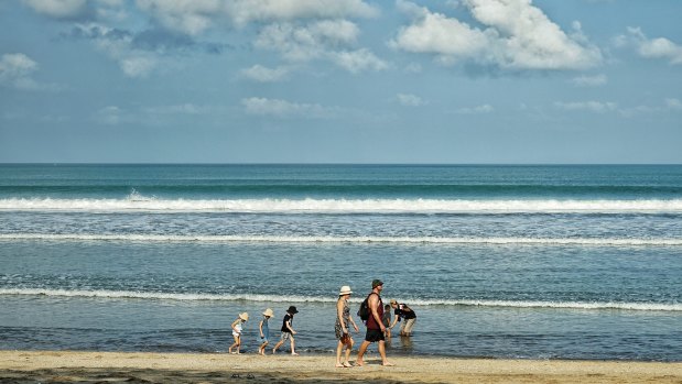 Tourists at Kuta beach.