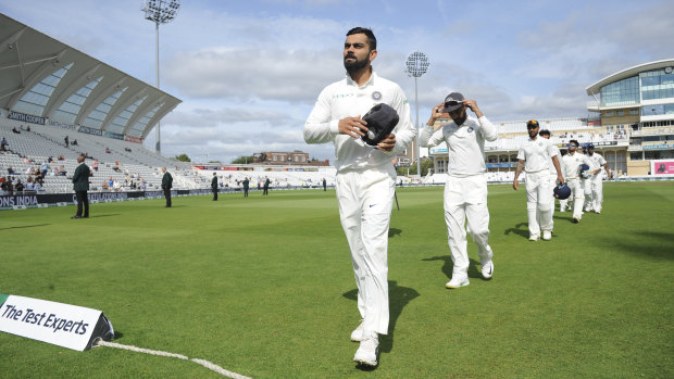 Dominant performance: Indian captain Virat Kohli leads his team off the field after beating England in the third Test.