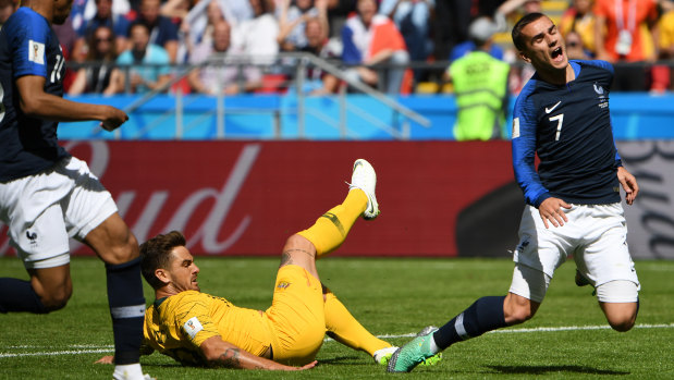 Unlikely career move: Josh Risdon fouls Antoine Griezmann.