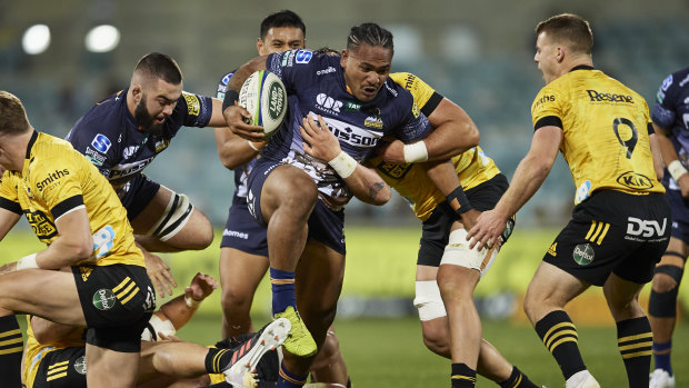 Brumbies winger Solomone Kata tries to find his way through traffic against the Hurricanes in Canberra.