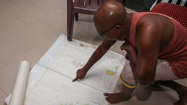 Fernando outlines the route towards Australia on a nautical chart.