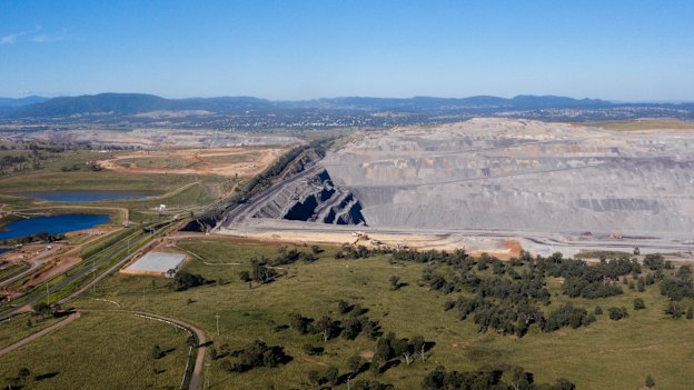 The Mount Pleasant mine, far left, and Bengalla mine, right, with the town of Muswellbrook in the distance.