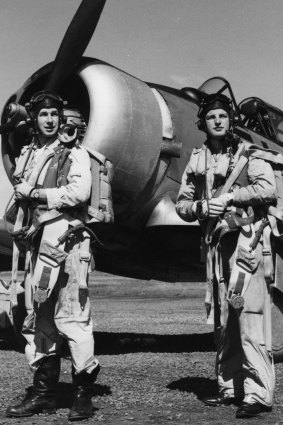 Ian Gordon (left) and coursemate in front of a CAC Wirraway aircraft.
