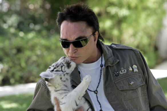 Roy Horn, of the illusionist team of Siegfried & Roy, kisses a six-week-old tiger cub at his Las Vegas home in 2008.