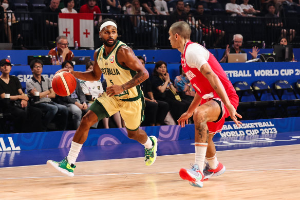 Patty Mills drives to the basket against Georgia.