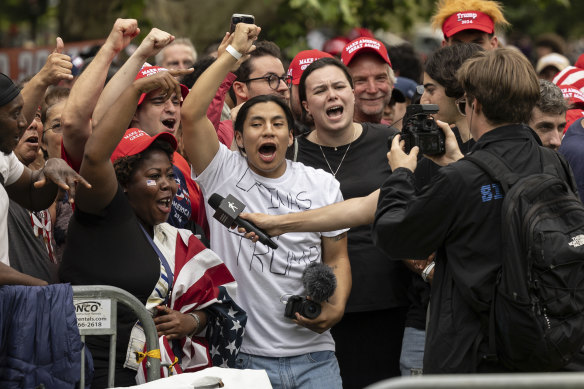 Trump supporters gather before a campaign rally in the Bronx borough of New York.