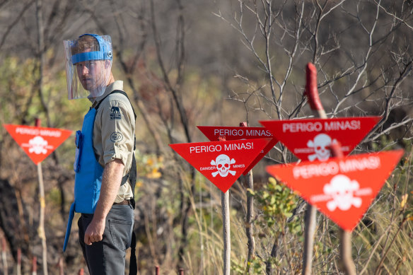 Britain's Prince Harry walks through a minefield in Dirico in Angola.