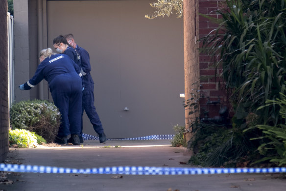 Forensic officers at the Park Street apartment block.