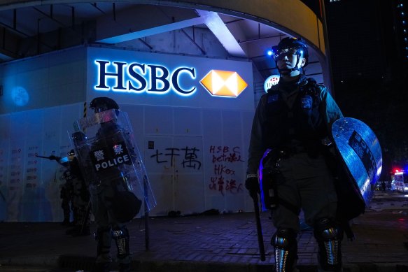 Police guard an HSBC bank branch on New Year's Day in Hong Kong.