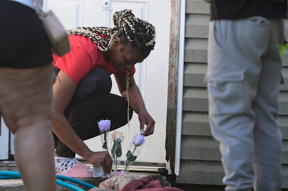 People leave flowers at one of the scenes. 