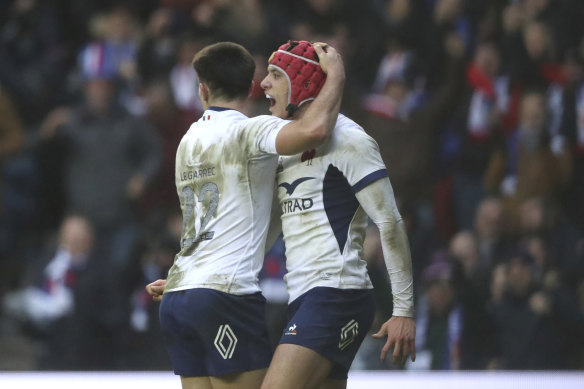 Louis Bielle-Biarrey celebrates after scoring a try.