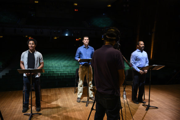 Daniel Yearwood, Josh Davis and T. Oliver Reid filming the Fatigue section of the new musical Breathe in an empty New York theatre.
