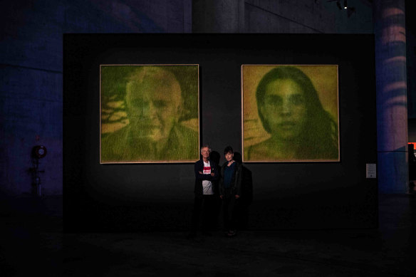Artists Heather Ackroyd and Dan Harvey with their grass portraits.