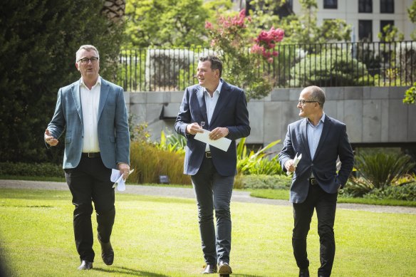 Health Minister Martin Foley, Premier Daniel Andrews and Education Minister James Merlino on Thursday. 