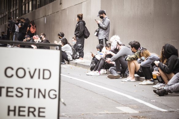 Queues of people outside a testing site in Melbourne earlier this year.