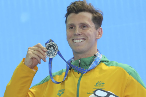 Thomas Fraser-Holmes shows off his silver medal at the FINA World Swimming Championships in China in 2018.