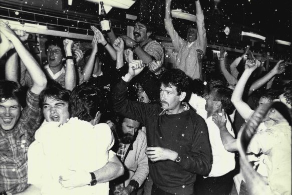 Patrons at the Middle Harbour Yacht Club go wild as Australia II crosses the line to win the America's Cup. The yacht club was one of the few yachting clubs to be open to celebrate the Cup win this morning, September 27, 1983.