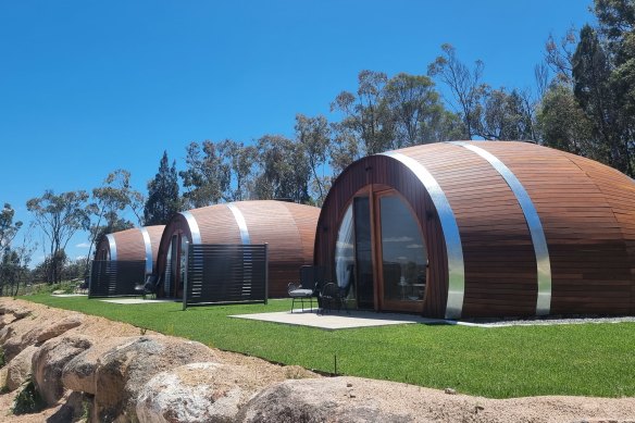 The three cabins are made to look every inch like oversized wine barrels.