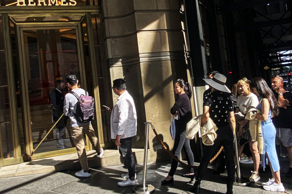 People Waiting In Line To Enter Louis Vuitton Paris France Stock