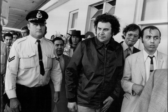 Greek composer Mikis Theodorakis  (centre) at Sydney Airport in 1972, the year he appeared at the Adelaide Festival.