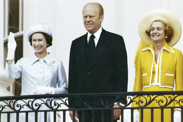 The Queen waves from the balcony of the White House, as she stands with president Gerald Ford and first lady Betty Ford in 1976. 