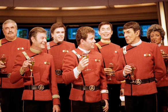 Members of the Star Trek crew, from left, James Doohan, DeForest Kelley, Walter Koenig, William Shatner, George Takei, Leonard Nimoy and Nichelle Nichols on the set of Paramount Studios in Los Angeles in 1988.