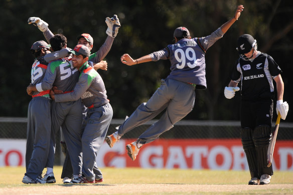 Afghanistan’s players celebrate after taking a wicket against New Zealand in the 2012 Under-19 World Cup on the Sunshine Coast.