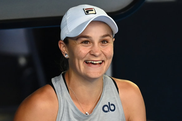 Ash Barty has a laugh during  practice.