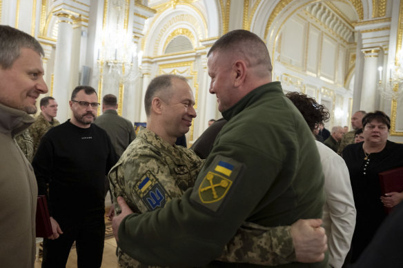 Valery Zaluzhnyi (right), the former commander-in-chief of Ukraine’s Armed Forces, hugs his successor, Oleksandr Syrsky, in Kyiv in February.