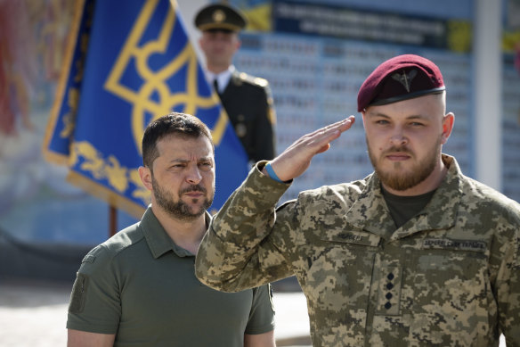 Volodymyr Zelensky (left) attends an event marking Statehood Day in Mykhailivska Square in Kyiv on Friday, July 28.