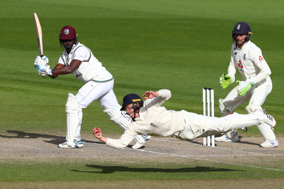  Ollie Pope of England takes the catch of Kemar Roach of West Indies to win the match on day five of the second Test. 