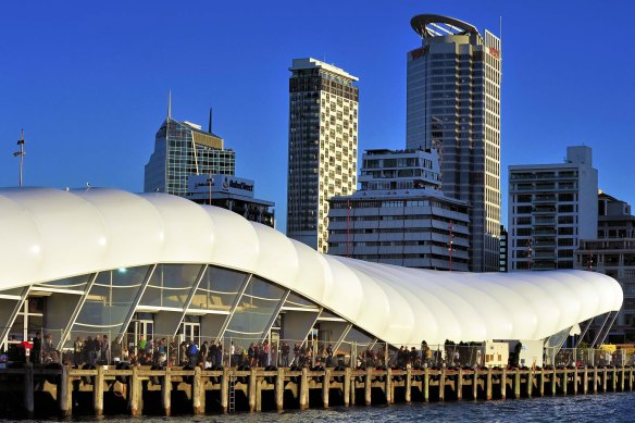 The long white roof of Queens Wharf cruise terminal in Auckland.