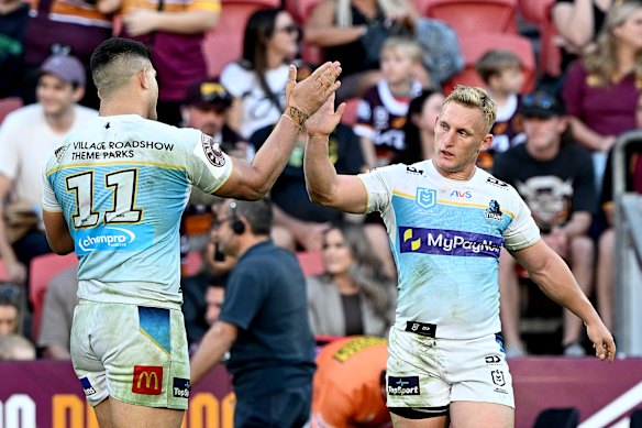 Tanah Boyd celebrates with David Fifita during Sunday’s win over the Broncos.