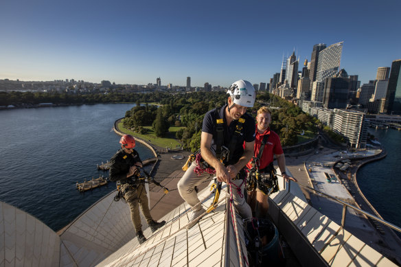 Opera House building operations manager Dean Jakubowski and height access specialists Morgan Pugh and Dean Gillies prepare to  inspect the shell of the sails on section A2, which includes the famous building’s highest point at 68 metres above sea level.