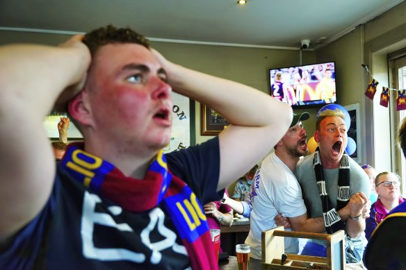 A Collingwood supporter celebrating at the Royal Derby.