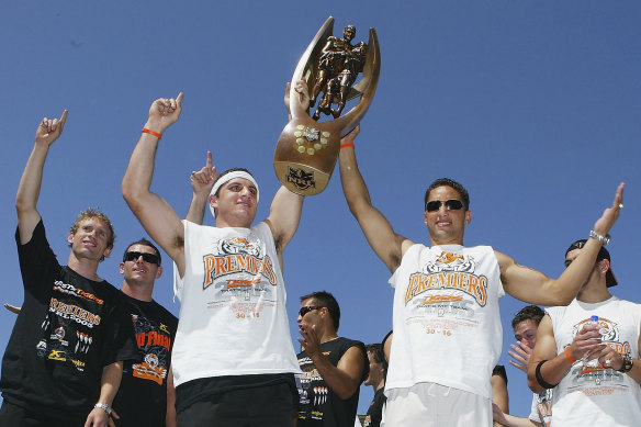 Robbie Farah and Benji Marshall celebrate the 2005 grand final triumph with teammates.