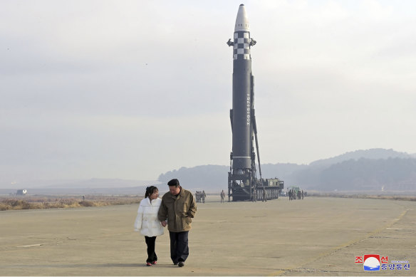 North Korean leader Kim Jong-un, right, and his daughter inspect the site of a missile launch at Pyongyang International Airport.