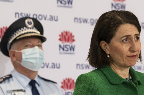 NSW Premier Gladys Berejiklian flanked by NSW Police Commissioner Mick Fuller on Saturday.